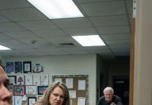 The crack of crushed cardboard under her fake nails made my stomach twist. I stood in the fourth-grade doorway, unseen, as Mrs. Elvira tossed the little boy’s handmade gift into the trash—the last present for the mother and father he had buried. “It’s just garbage,” she sneered. Then an old man stepped from the hallway shadows and whispered, “Say that again… if you want to keep your soul.” What happened next still haunts me.