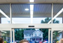 I was stocking shelves at the supermarket when my six-year-old son came running in, sobbing so hard he could barely breathe. “Mom! Come home now! Dad is on the floor—and there are men in the house!” Minutes later, I pulled into my street and saw police cars outside my home. My husband was alive… but the truth waiting inside was far worse than death. What I found that day destroyed everything I thought I knew.