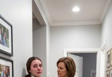 “I told myself the scratches on my wife’s neck had to be from our toddler—some accidental grab, some harmless little moment. Then I checked the nursery camera. My mother looped a scarf around my wife’s throat, pulled it tight for a few terrifying seconds, and whispered something that made her freeze. I sat there staring at the screen, unable to move, because the woman who raised me suddenly looked like a stranger… and I still don’t know what I’m supposed to do with that truth.”