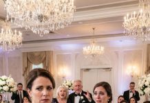 I stared at the place card in my hand, sure it had to be a mistake, until Mom leaned in and whispered, “That means no seat at the family table.” My chest went cold. Minutes later, I stood at the gift table, pulled back my $10,000 check, and said, “Since I’m just a courtesy, so is this.” Then my sister ran after me in her wedding dress screaming my name—but…
