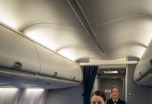 I was just an Army mechanic flying economy when two Navy officers had me kicked out of first class. One of them laughed and said, “Support staff shouldn’t sit up here.” I stayed quiet and walked back to row 29. But an hour later, smoke filled the cabin and the captain suddenly stepped out of the cockpit, scanning the passengers before calling my name: “Staff Sergeant Mercer, I need you up here—right now.” And in that moment, everyone who doubted me went silent.