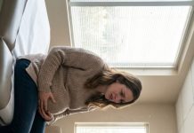 My husband always brushed it off—“She’s just hot-tempered, Emma. Don’t take it personally.” Then his mother stormed into my appointment, jabbed a finger at my swollen belly, and screamed in front of the doctor, “You’re lazy, you’re dramatic, and you’re trapping my son!” The room went dead silent. The doctor’s voice turned icy: “Ma’am, that is abusive. Leave.” Ryan finally looked at me—and I saw him decide. But leaving her? That was only the first fallout.