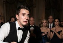 I was just a waiter carrying coffee to the coldest billionaire in the room—until one slip changed my life forever. The cup splashed his sleeve, and beneath the stain I saw it: the exact tattoo my mother had hidden for years. My voice trembled. “Sir… my mother has that same mark.” He went pale, dropped to his knees, and whispered, “Then you were never supposed to find me…”