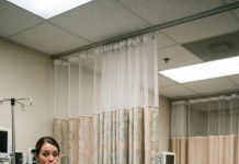 Forty-three minutes before my cancer surgery, my husband texted, “I want a divorce. I wasn’t built to care for a sick wife.” I couldn’t even cry. Then the patient in the next bed placed a napkin by my face. “If I survive this, marry me,” I joked weakly. He squeezed my hand and said, “Okay.” A nurse froze and whispered, “Do you know who he really is?”