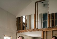 While I was away on a work trip, my so-called mother-in-law split our house into two separate living spaces and demanded I pay $100,000 for the renovations. I stared at the invoice and said, “Huh? But I’m not married.” She blinked and whispered, “What do you mean?” That was when the truth came out… and the man pretending to be my husband started sweating.