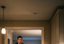 My husband came home from his business trip two days early and froze at the kitchen door. I was sitting on the cold floor, chewing the last bit of meat from a bone, while his parents and sister laughed in the living room, watching TV. “Why is my wife eating scraps?” Ethan asked, his voice shaking. His mother smirked. “She knows her place.” But what he did next left the whole house silent…