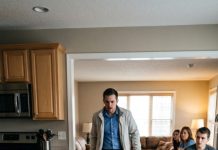 I thought my husband’s early return from his business trip would save me. Instead, when he opened the kitchen door, he found me sitting on the cold floor, gnawing on leftover bones while his entire family laughed in the living room, feet up, watching TV. His mother froze. His sister whispered, “Don’t tell him.” My husband looked at me, then at them, and said, “Who did this to my wife?”