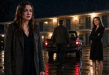 I buried my father at noon, and by dinner, my sister was smiling over the deed to his luxury apartments. “You got the motel because you’re worthless,” my husband hissed, shoving my suitcase into the rain. So I slept in that rotting office, freezing and humiliated—until the floorboards groaned beneath me. I pulled them up… and found a locked steel door with my name scratched into it.