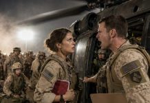 The Black Hawk was my last way out—but Lieutenant Hendricks blocked the door with his clipboard. “You’re not on the manifest,” he snapped. Behind me, the perimeter alarms screamed. I looked past him at the dust-choked runway and whispered, “Then everyone on that helicopter is already dead.” His face went pale when I pulled the sealed intel file from my vest… because the real evacuation order had my name on it.