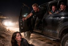 My husband shoved me from the truck onto a deserted desert road while his friends howled with laughter. “Relax,” he sneered. “The coyotes will find her before the cops do.” I watched their taillights disappear, then pulled out the satellite phone he never knew I carried. Hours later, he found my letter on our bed. When he read the final line—“You betrayed the wrong woman”—he collapsed to his knees… just as someone unlocked the front door.