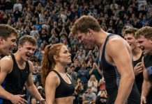 Dakota Williams leaned over me and sneered, “Girls don’t fight. They cry and run away.” Three hundred people laughed as his teammates circled the mat like wolves. I looked smaller than all of them—until I whispered, “Then why are your hands shaking?” The gym went silent. Dakota charged first, thinking I was afraid. He didn’t know the truth: I hadn’t come to compete. I had come to expose him.
