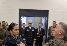 I saw his fist before the room understood what was happening. “Stand down, Commander,” General Holloway growled, swinging anyway. My hand closed around his wrist mid-air, and two hundred soldiers stopped breathing. “You picked the wrong woman to test, sir,” I said quietly. His face went pale when the Navy captain at the door shouted, “She’s a twenty-year SEAL veteran.” But what came next silenced everyone.