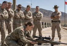 They laughed before I even touched the rifle. “Range day just got interesting,” someone muttered. I didn’t answer. I just adjusted the bipod, felt the wind shift, and whispered, “Quartering left… drifting early.” The first shot rang out. Steel screamed. Center hit. Then a second. Then a third. The laughter died fast. “Who trained you?” the officer asked. I cleared the rifle and said, “The unit you were told never missed.”