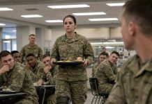The first time I entered that dining hall, all they heard was my limp. “She’s gonna slow everybody down,” someone whispered. I said nothing—until the convoy exploded and three men were trapped inside the flames. Sergeant Morrison screamed, “Hayes, no!” But I was already running. When I came back broken, burned, and barely standing, the dining hall went silent again… and this time, the Colonel rose first.