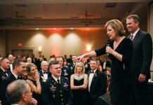 “My own mother pointed at me in front of 200 people and said, ‘This is the disappointment of our family.’ The room laughed, and I stood there taking every word—until a retired Army Colonel suddenly rose to his feet and shouted, ‘Do you people have any idea who this man really is?’ In seconds, the humiliation turned into something nobody expected, and the secret I had buried for years was about to destroy the biggest lie my family had ever told.”