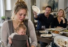 When I arrived at my daughter’s house, she was holding her crying baby with one arm while washing a mountain of dishes with the other. Her husband and mother-in-law relaxed at the dinner table like royalty. “Move faster,” he snapped. “Bring us more food!” My daughter lowered her eyes, trembling. I quietly took out my phone and called one person. They kept laughing—unaware that before dessert, everything they owned could be taken away.