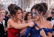 At the masked gala, my jealous half-sister ripped my blue gown and sneered, “Cheap fabric for the unwanted daughter.” Humiliated, I called my husband. Minutes later, he entered with six bodyguards, wrapped his coat around me, and demanded, “Who did this?” I pointed at her. His expression turned icy. “My wife deserves respect.” Then he exposed her fraud, canceled her family’s contracts, and had security drag her from the ballroom.