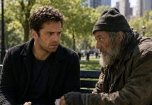 Three days after I buried my wife, I sat alone on a park bench and offered half my sandwich to a homeless man. He stared at me, then slipped a crumpled phone number into my hand. “Call this tonight,” he whispered. “Your wife didn’t die by accident—and your father-in-law knows why.” My blood turned cold. Before I could question him, he vanished into the crowd. That night, I dialed the number… and heard my wife’s voice.
