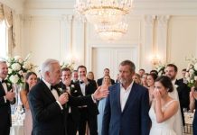 My daughter’s father-in-law raised his champagne glass, looked straight at me, and laughed, “A broke mechanic has no place in this family.” Four hundred guests applauded while my daughter cried in silence. I slowly stood, smiled, and asked one question that froze every face in the ballroom: “Do you even know who I am?” His glass slipped from his hand… and the wedding became the beginning of his downfall.