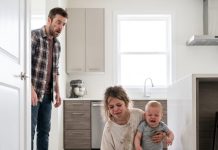 My 7-year-old daughter called me crying and whispered, “Daddy… my back hurts. I can’t carry the baby anymore.” When I rushed home, I found her holding her 6-month-old brother while cleaning up spilled milk in the kitchen. I didn’t scream. I just quietly opened the security cameras… and what I saw ended my marriage before dawn.