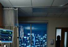 Everyone abandoned my husband the moment doctors said he might never wake up. His entire family boarded a flight to Australia, leaving me alone beside his hospital bed. Minutes after their plane took off, his fingers tightened around my hand. He slowly opened his eyes and whispered, “Emily… don’t call anyone. Come with me now… or we’re all in danger.” I thought he was confused from the coma—until I saw the terror in his eyes.