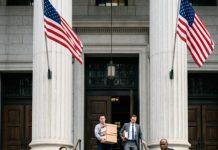 The slap echoed across the courthouse steps before anyone could react. My stepbrother wrapped his hand around my neck, spat in my face, and screamed, “You’re an animal! You’re the disgrace of this family!” Strangers stared while my own relatives looked away. I wiped the spit from my cheek, tightened my grip on the sealed court file, and whispered, “Go ahead… you’ll regret this in five minutes.” He laughed—until the courtroom doors opened.