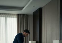 I came home sick, planning to sleep it off, when I heard the front lock turn. I hid behind the sofa, thinking it was a burglar—then my husband walked in. He crept to my side of the bed, pulled out a tiny bottle, and dripped clear liquid onto my pillow. “By morning, she’ll be too weak to ask questions,” he whispered. I froze, realizing my illness might not be an accident…