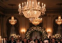 On my son’s wedding day, his bride smiled, grabbed a bottle of champagne, and poured it over my head in front of every guest. The room fell silent as she laughed, “Now everyone knows your place!” I didn’t scream or fight back. I calmly picked up the microphone, looked straight at her, and said, “Before this wedding continues, everyone deserves to know your biggest secret.” Within seconds, she was begging me to stop.