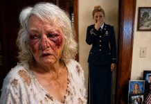 I came home early to surprise my mother and wife, but the sight in the kitchen stopped me cold. Mom was bleeding, trembling from hunger, desperately forcing scraps of food into her mouth while my wife lounged nearby, laughing over a glass of wine. “She’s being dramatic,” my wife said. I stared at my mother’s bruises, then quietly locked the front door. “Enjoy that wine,” I whispered. “By tomorrow, you may have nothing left to celebrate.”