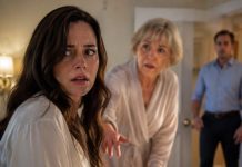 I thought my mother-in-law hadn’t walked in six months—until she suddenly rose from her wheelchair, locked the bedroom door, and grabbed my wrist. “Maren, if you sleep in this house tonight, my son may kill you.” I almost laughed from shock. Then she pulled a hidden recorder from beneath her mattress. When I heard my husband’s voice say, “Maren will take the blame,” I realized our marriage had never been the real trap.