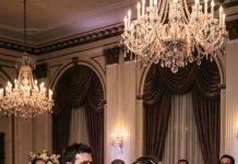 “The moment my husband slammed my face into our wedding cake, the room exploded with laughter. Then I heard my own voice whisper, ‘If I stay, this is only the beginning.’ While guests thought I would forgive him, I quietly stood up, wiped the frosting from my face, and walked toward the microphone. ‘Before I leave,’ I said, ‘there’s something every one of you deserves to know.’ The silence that followed changed every life in that ballroom forever.”