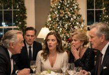 At Christmas dinner, my billionaire biological father casually asked, “You’re still living in the house I bought for you, right?” I froze. “Dad… I’ve never lived in any house you bought.” He slowly turned toward the parents who raised me, and both of them went pale. Then his attorney set down his fork and asked one question that changed everything: “Where has eight years of rental income gone?”