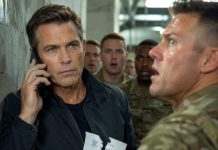 The sergeant shoved me against the wall and laughed. “You think you’re important? Get on your knees and apologize.” I stayed silent as the entire room watched him humiliate me. He had no idea who I really was—or why I had walked into that base alone. Then my phone rang. I answered, and the voice on the other end said, “Sir, the entire command is waiting for your orders.” That was the moment his smile disappeared.
