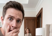 I came home early after weeks away, expecting my wife to run into my arms. Instead, my mother smiled too quickly. “She’s upstairs resting. Don’t wake her.” I found my wife unconscious beneath the blankets. When I pulled them back, my blood turned cold—her body was covered in bruises, some fresh, others fading. Then she grabbed my wrist and whispered, “Your mother said you would never believe me…” Before I could answer, the bedroom door locked behind me.