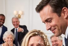 The birthday cake exploded against my face before I even understood what my husband was doing. Frosting slid into my eyes as everyone around the table laughed. He leaned closer and sneered, “Didn’t you want cake? Then eat as much as you want.” I slowly wiped the cream from my face and stared at him. “Enjoy laughing,” I whispered. “Because when I open the envelope in my purse, none of you will be smiling.”