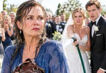 My son’s wedding day was supposed to be the happiest day of my life. Instead, my daughter-in-law blocked me at the door, aimed a garden hose at me, and drenched my dress in front of hundreds of guests. “Look at this disgusting beggar!” she sneered. Everyone laughed—until my son suddenly stepped forward, his face pale. “Mom… what did you bring with you?” He had no idea what was hidden inside my old handbag.