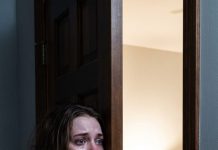 For six months, I spoon-fed my bedridden mother-in-law and cleaned her messes while my husband praised my sacrifice. Then, at 2 AM, I crept past her cracked bedroom door. Helen was sitting upright, pouring scotch and laughing into her phone: “The naive fool hasn’t signed the trust over yet, but she will by Friday.” My blood ran cold. They thought I was their exhausted caregiver—until I pressed record.